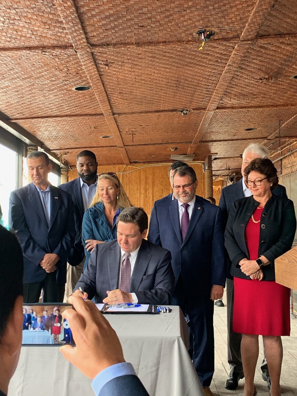 :LaBelle Commissioner Hugo Vargas was in the front row as Governor Ron DeSantis signed the last two bills for 2022 into law.